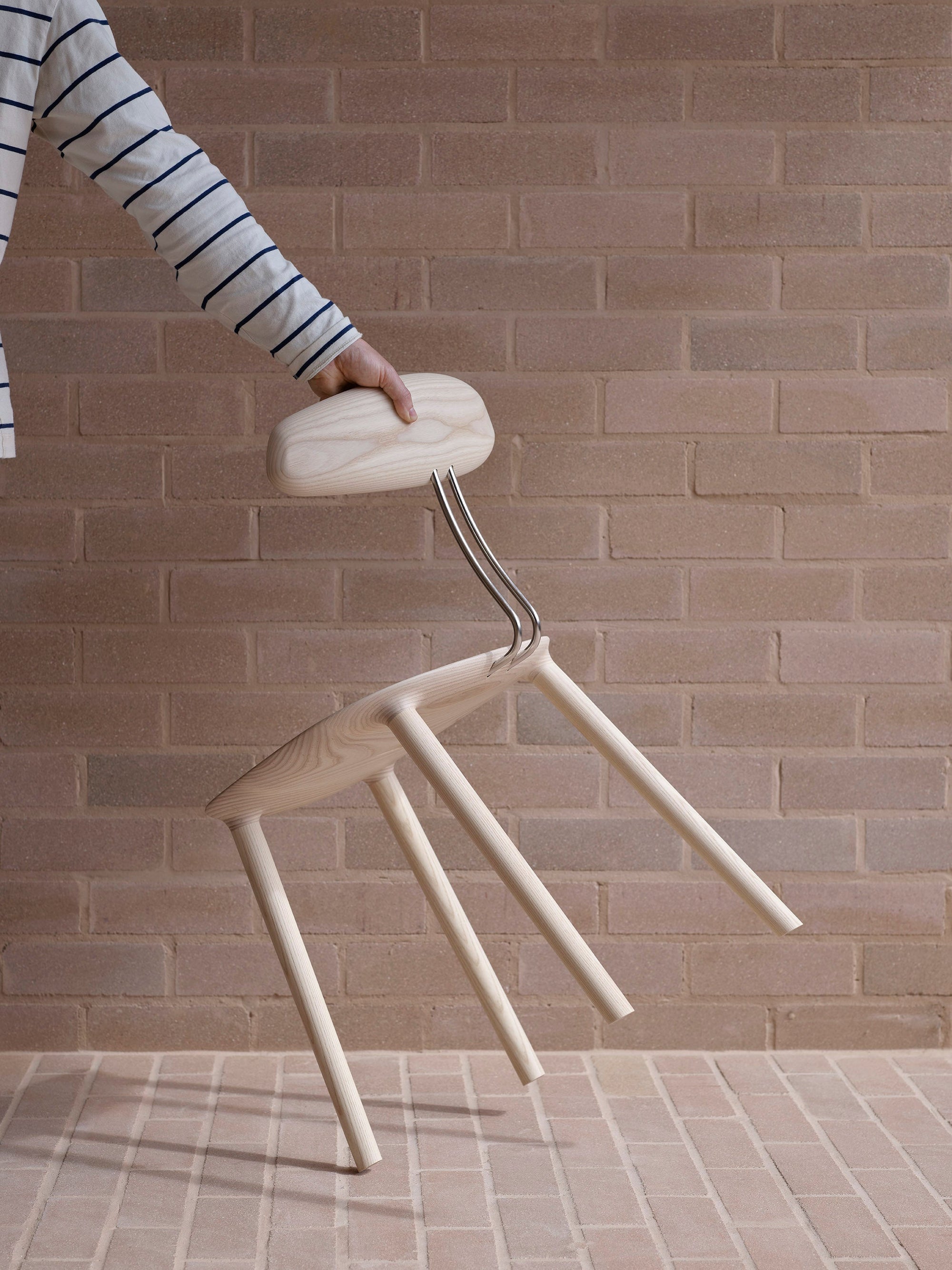 Mast Furniture stem chair in White ash tilted on side