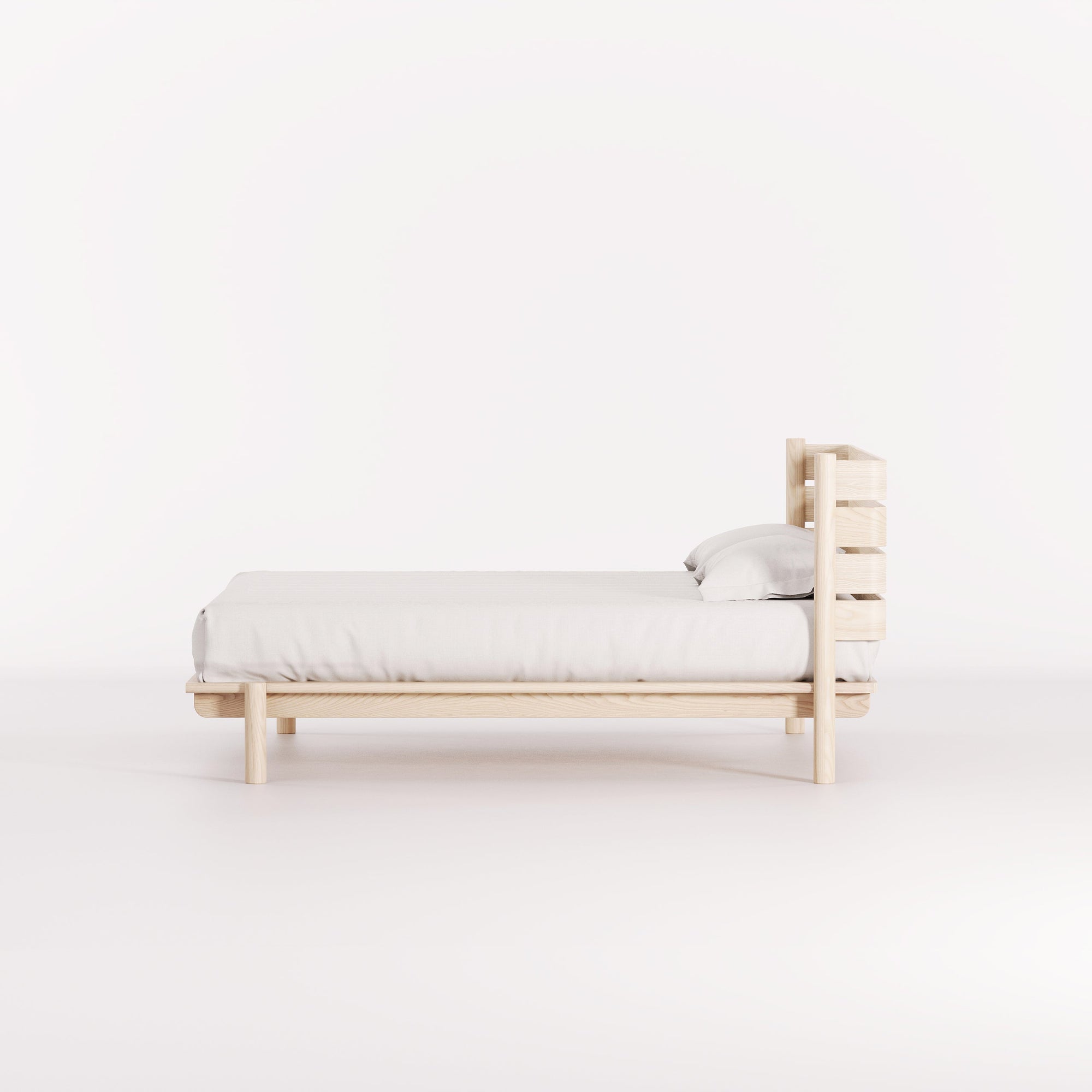 A modern, Australian made, timber bed with headboard.