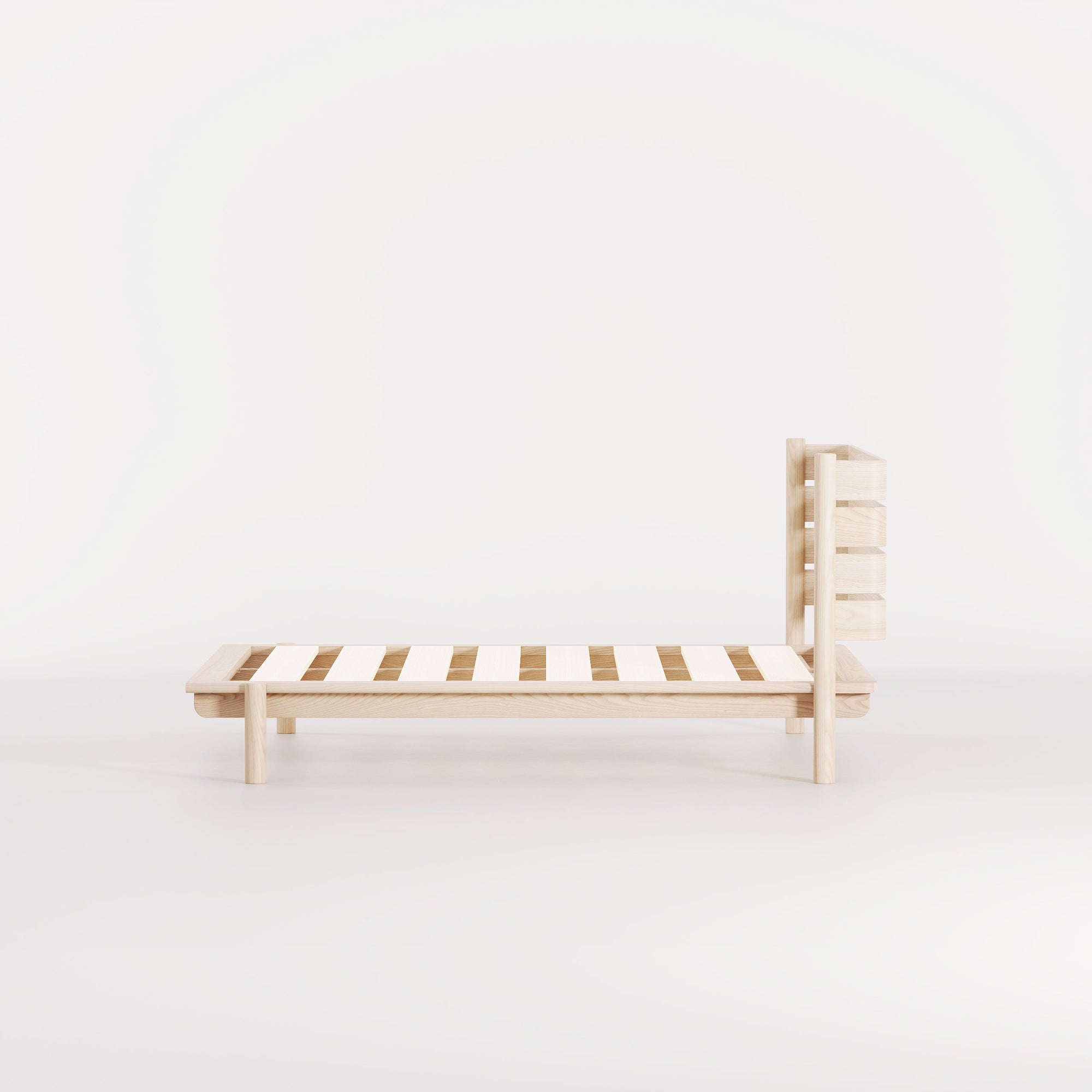 A modern, Australian made, timber bed with headboard.