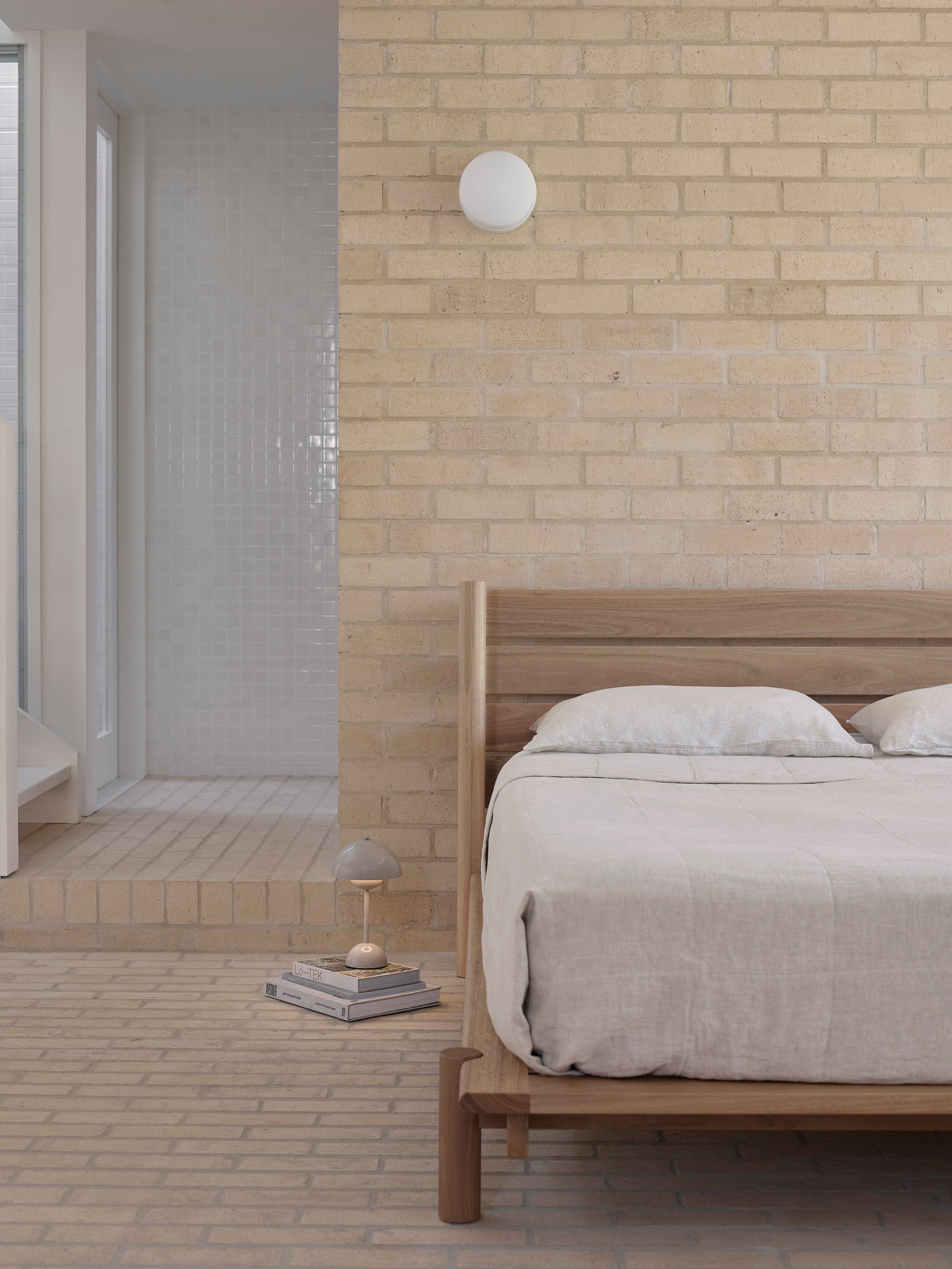 A title bed 03 in spotted gum with brick wall in background. 