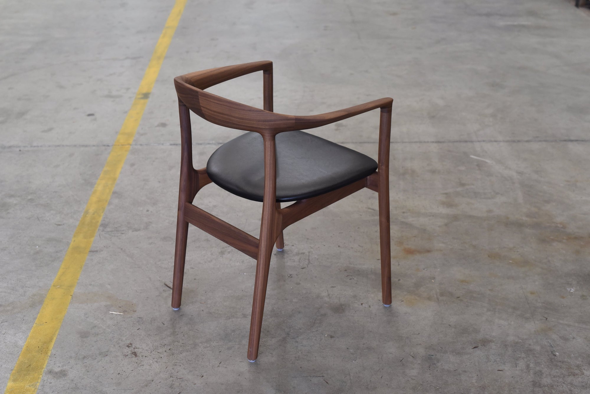 Swan chair by Mast Furniture. A mid century design chair in Walnut and Black leather 