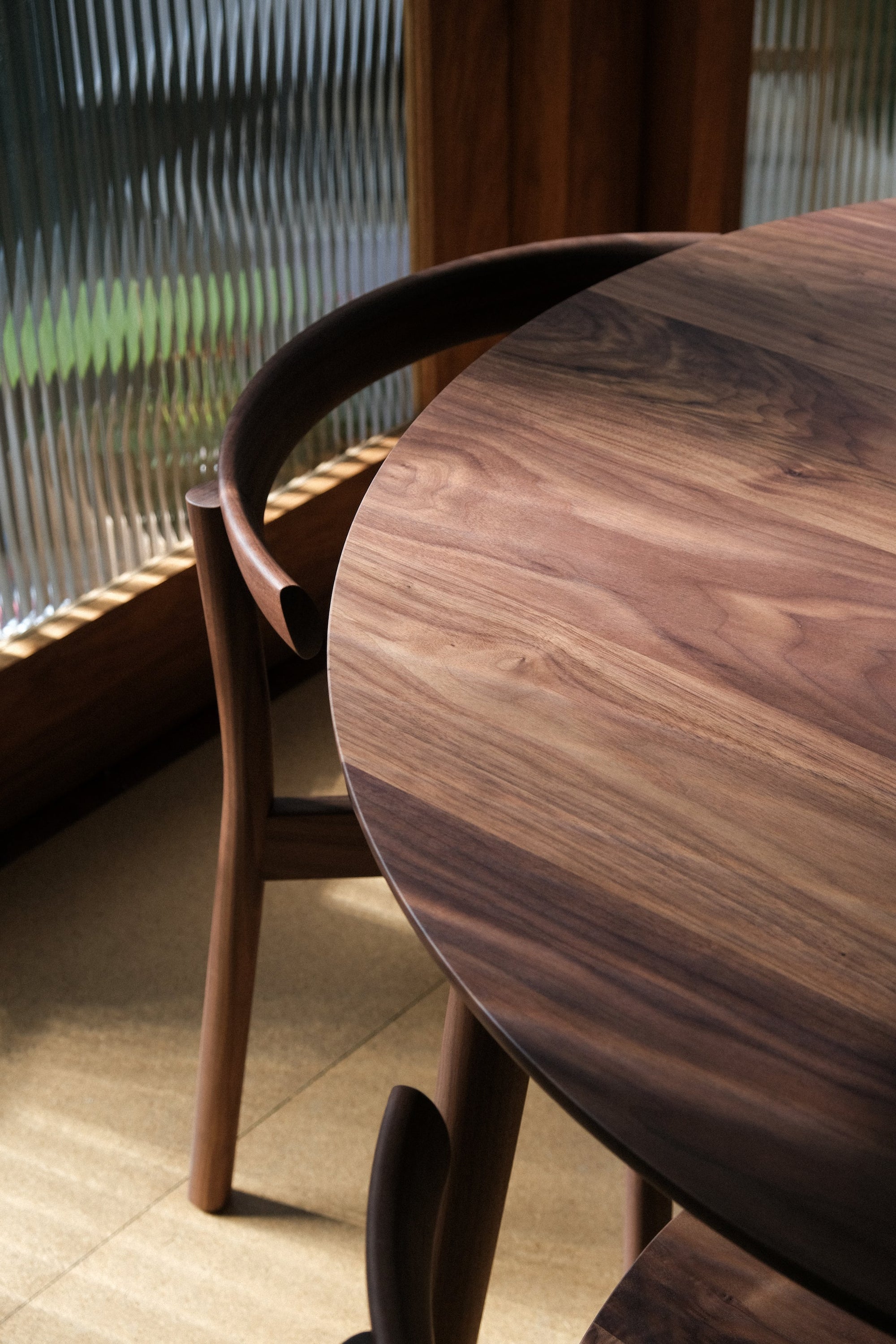 Torii dining table and chair in walnut. 